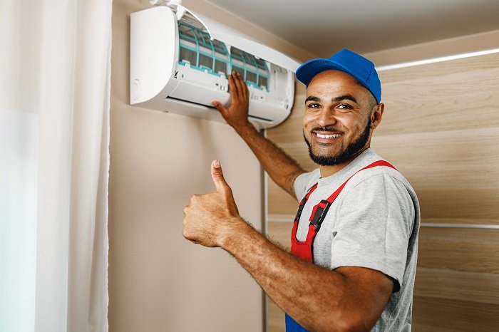 Arctic AC certified HVAC engineers installing air conditioning systems in Manchester homes and businesses
